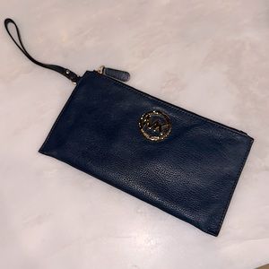 Michael Koran large navy wristlet with gold emblem